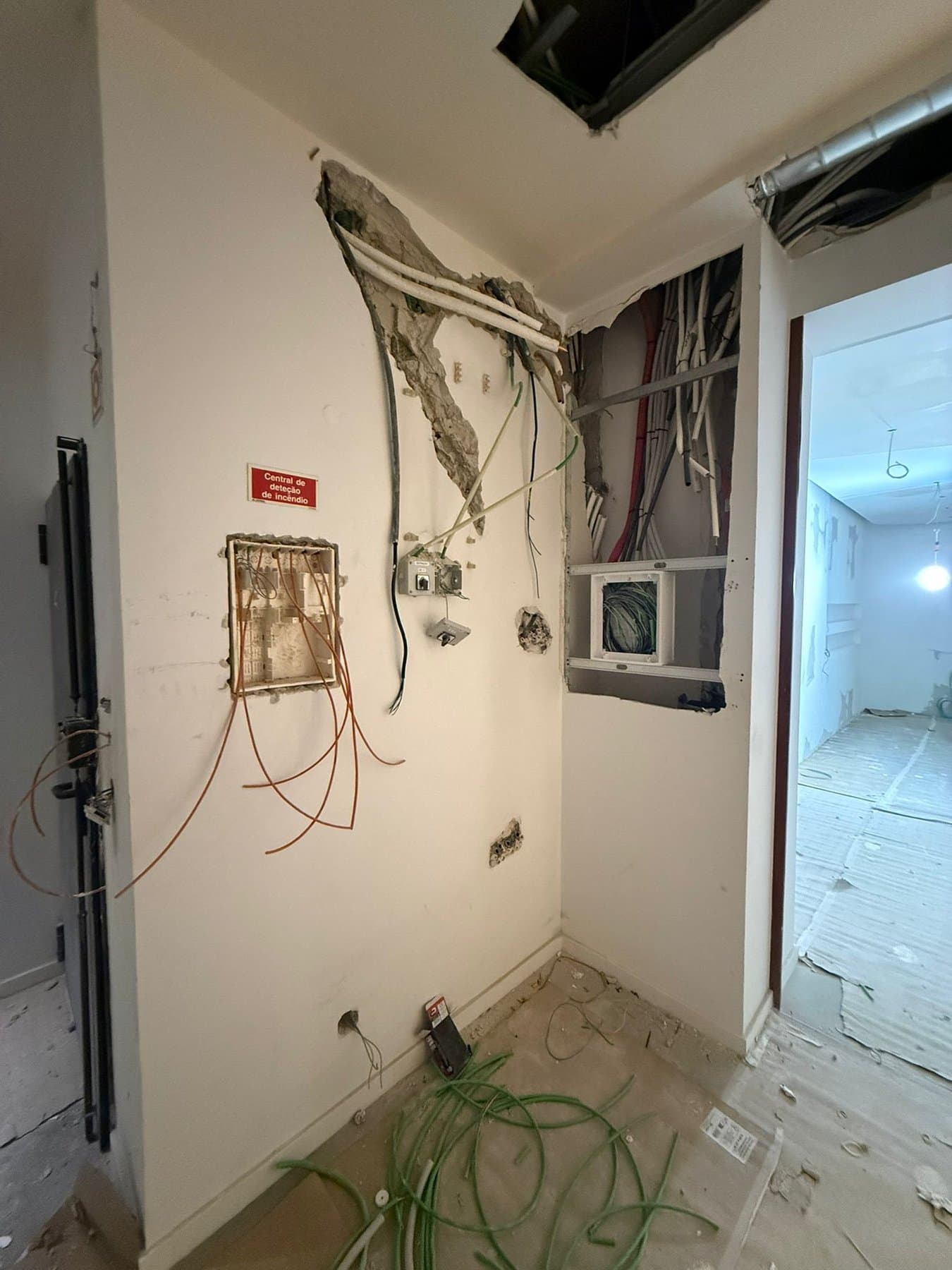 Conduit and signage on the wall